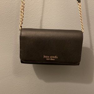 Small, black Kate Spade purse.